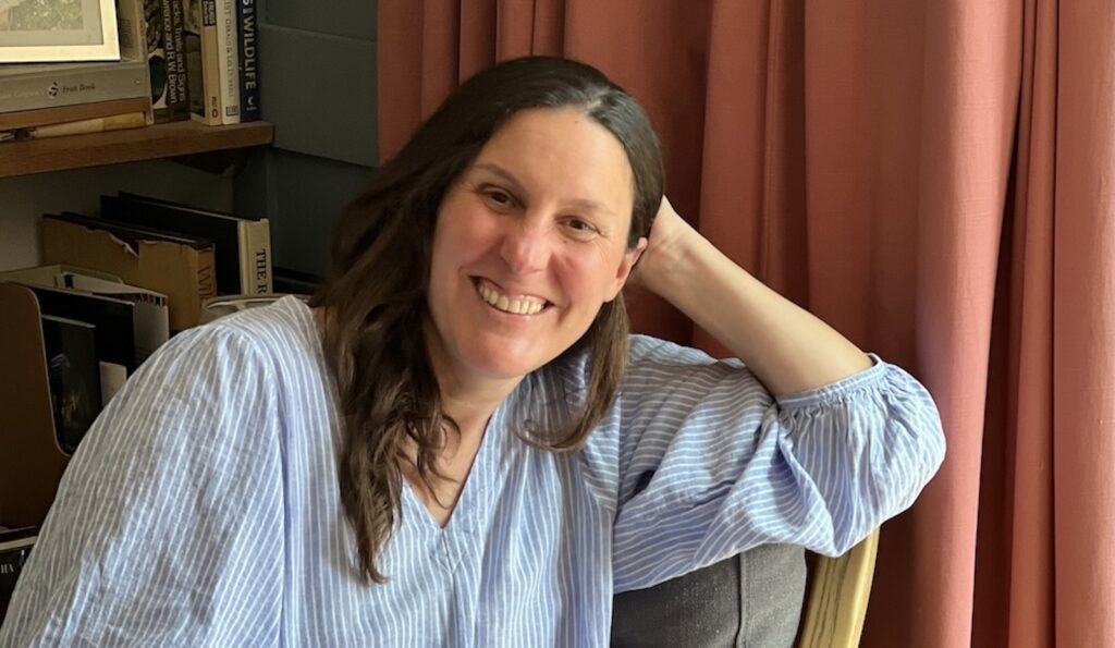 Woman seated in an armchair during a virtual brand photography session