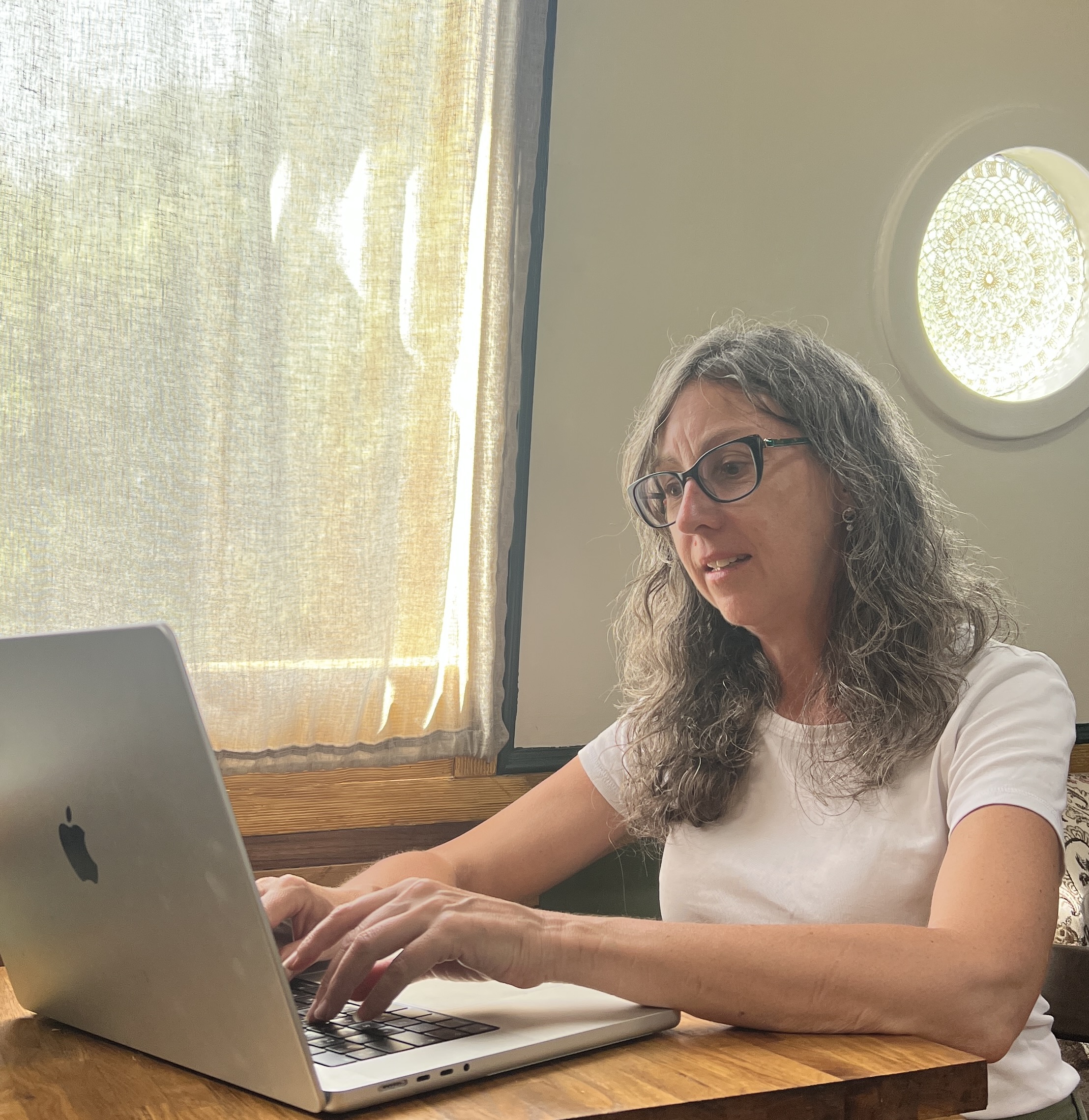 Brand photographer preparing and guiding a client session in a relaxed setting