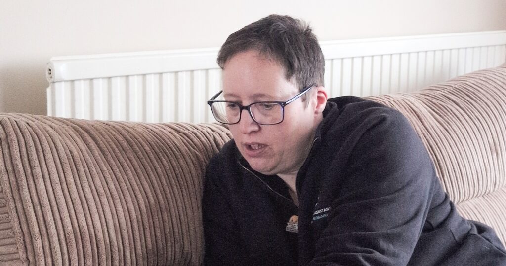 Female looking downwards on saf during a relaxed photoshoot